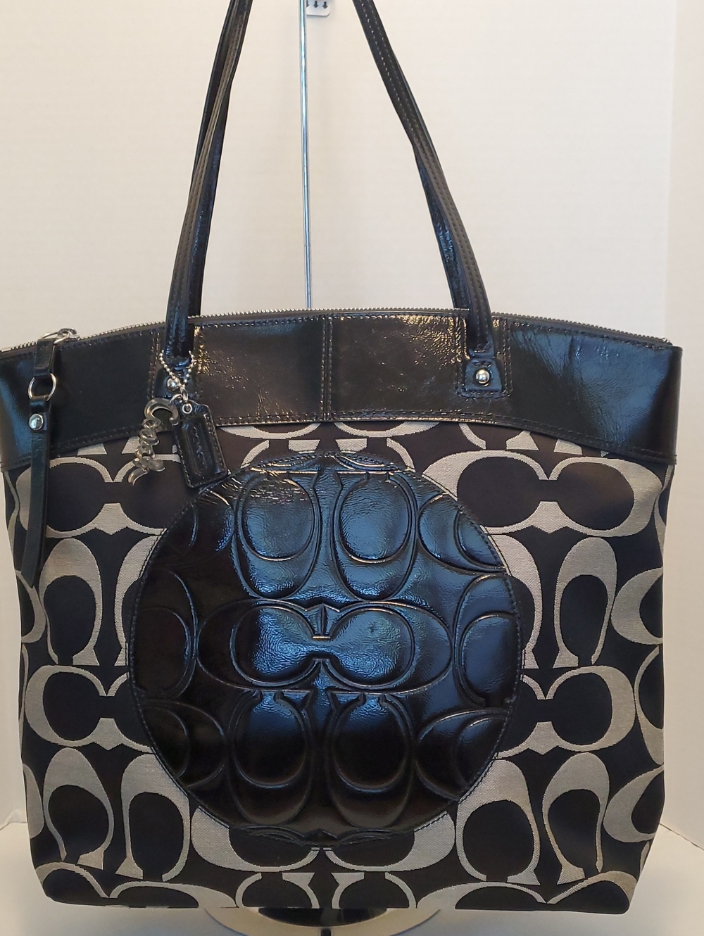 Coach Black and Beige Signature Canvas Tote with Glossy Leather Medallion